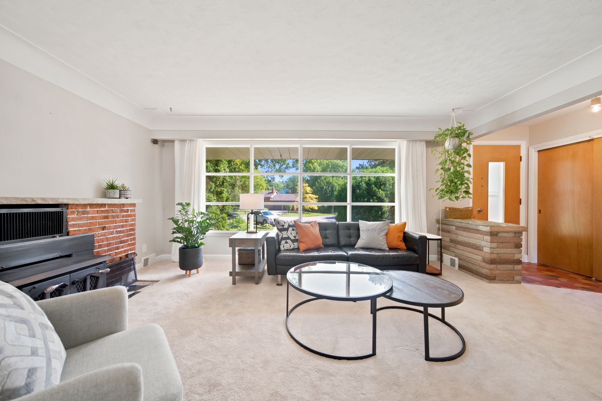 Spacious living room with wood-burning fireplace