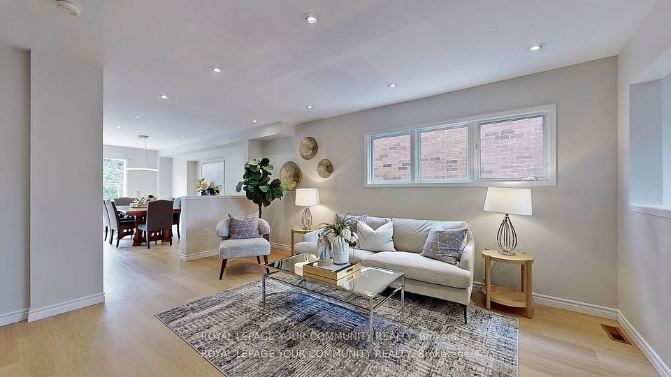 The living room at 3374 Scotch Pine Gate &mdash; bright, open and flowing through to the dining area