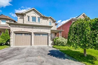 Front exterior of the all-brick detached 2-storey home at 81 Alamo Heights Drive, Richmond Hill, with attached 2-car garage